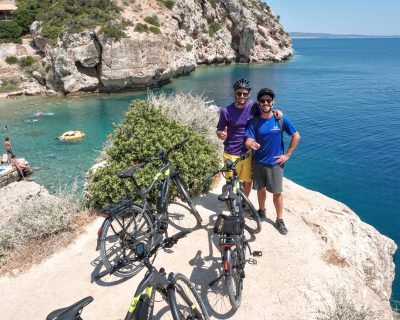 Cyclists ebiker at Vouliagmeni Lagoon Greece